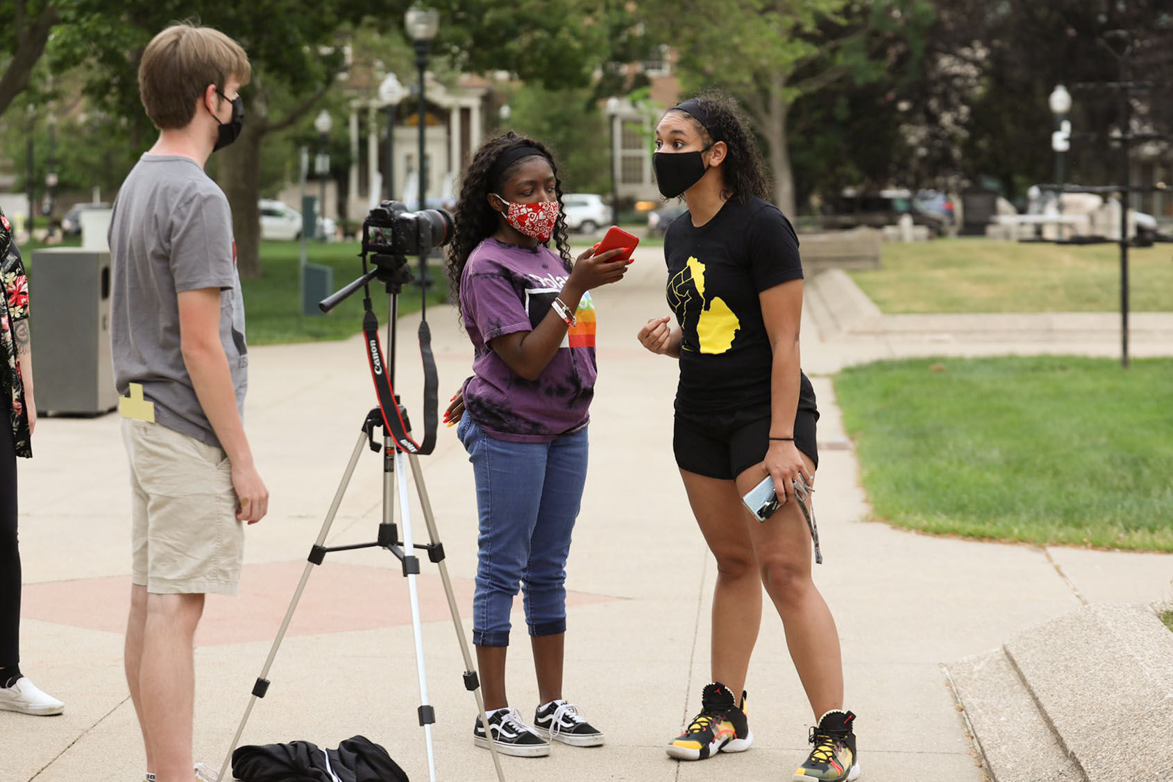 News Editor Destini Lindsey interviews an activist at a memorial for George Floyd in Bronson Park.